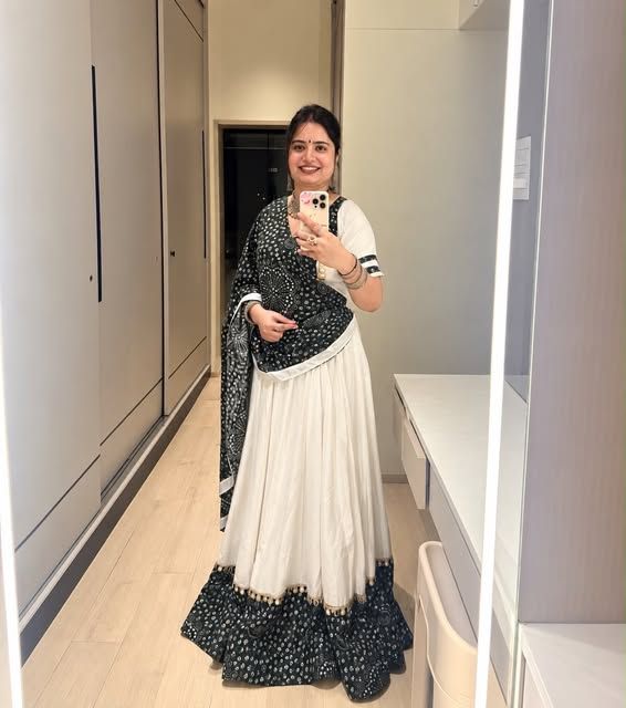 Woman in an ivory and black chaniya choli